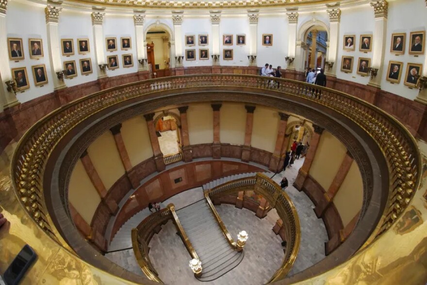 As viewed through a fisheye lens, the rotunda where portraits of presidents are displayed, except for President Donald Trump, is shown after the picture was removed from the wall of the rotunda in the State Capitol following complaints about the likeness from Trump, March 25, 2025, in Denver.