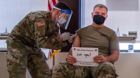 Col. Aaron Pitney, General Leonard Wood Army Community Hospital commander, receives the COVID-19 vaccination in January. All active duty personnel in the Army are required to get the shot by December 15.