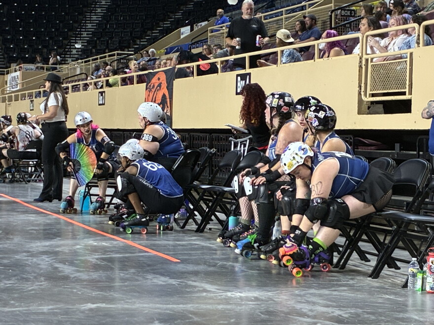 The Twin Valley Roller Derby Mountain Mayhem bench during a game against the Carolina Bootleggers.