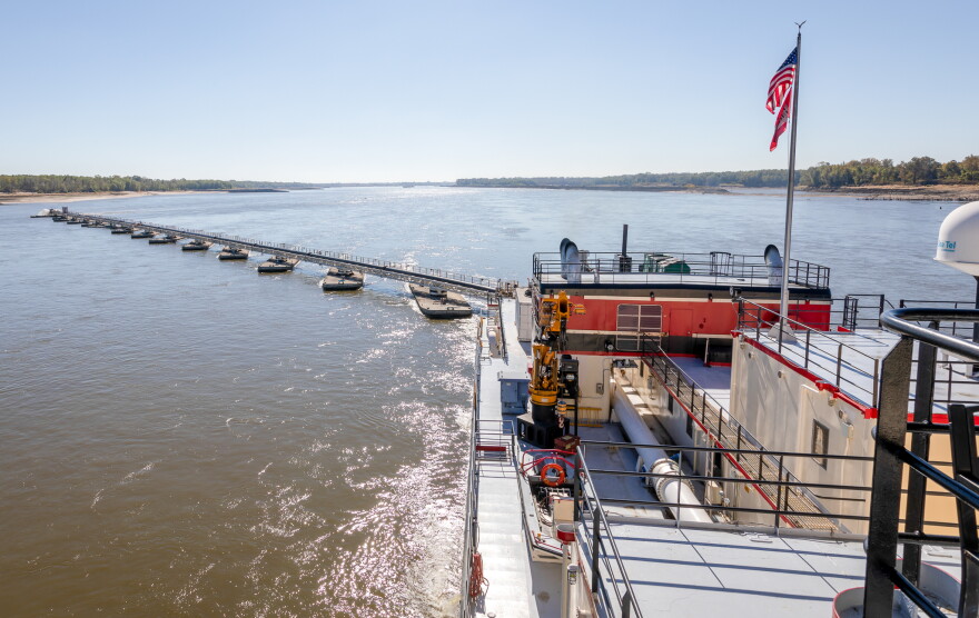 Sediment is pumped through a 32-inch pipe through the middle of the dredge across a series of pontoons to a shallower part of the river.