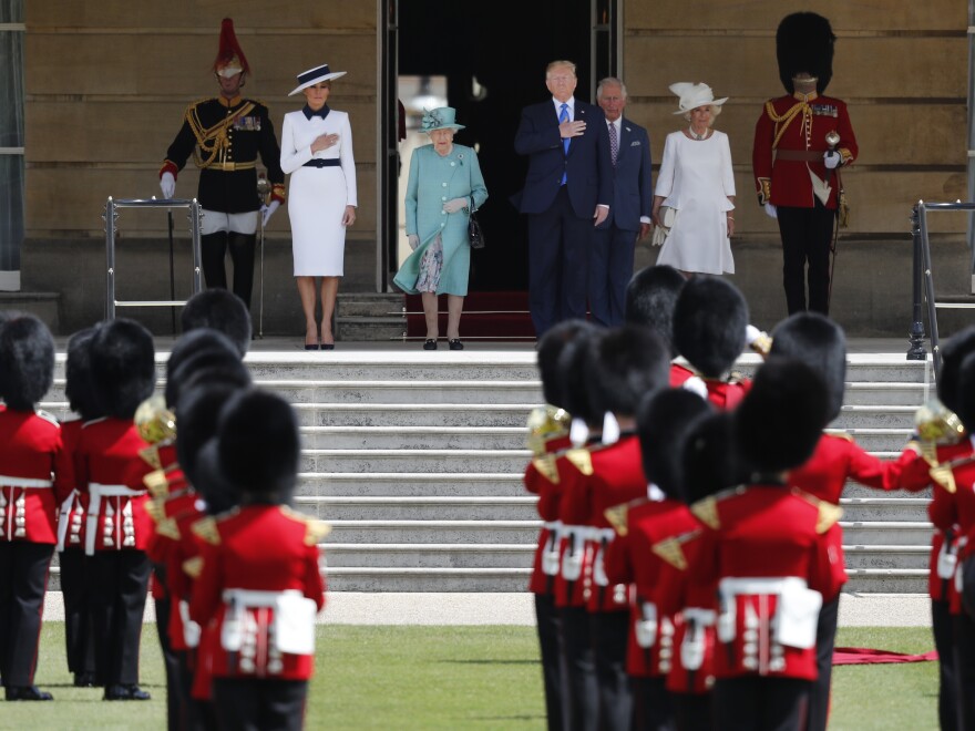 Queen Elizabeth II, President Trump, first lady Melania Trump, Prince Charles and Camilla, Duchess of Cornwall, listen to the U.S. national anthem during a ceremonial welcome in the garden of Buckingham Palace in London on Monday.