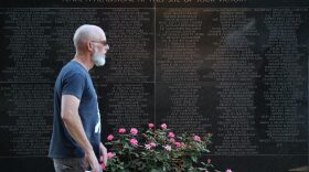 People visit the memorial to the Black Wall Street Massacre in Tulsa, Oklahoma. 