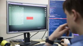 An employee of Global Cyber Security Company Group-IB develops a computer code in an office in Moscow, Russia, Wednesday, Oct. 25, 2017. (Pavel Golovkin/AP Photo)
