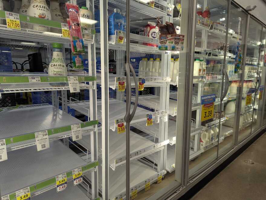 Milk shelves at the grocery store run low in Louisville, Kentucky. 