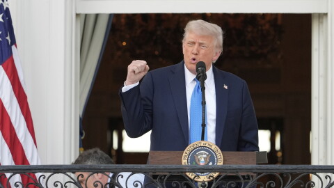 President Donald Trump speaks at a balcony