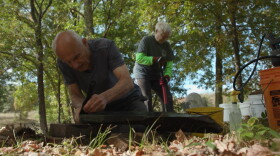 Carlo and Betty Mencucci restore gravestones.