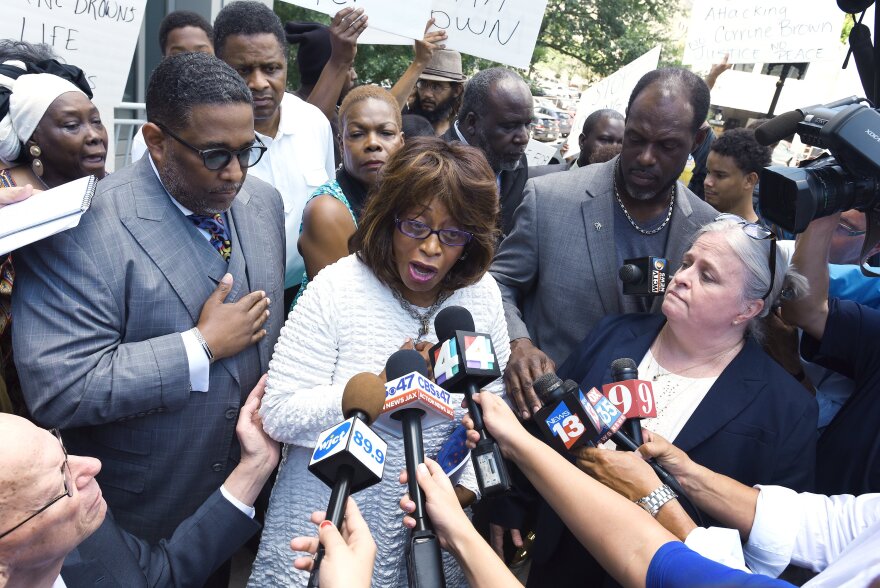 U.S. Rep. Corrine Brown addresses the media outside the Federal Courthouse, Friday, July 8, 2016, in Jacksonville, Fla. Brown and her chief of staff have been charged with multiple fraud and other federal offenses in a grand jury indictment unsealed Friday. (Bob Self/The Florida Times-Union via AP)