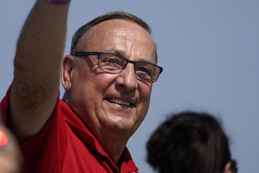 Former Gov. Paul LePage, a Republican gubernatorial candidate, marches in the State of Maine Bicentennial Parade, Saturday, Aug. 21, 2021, in Lewiston, Maine.