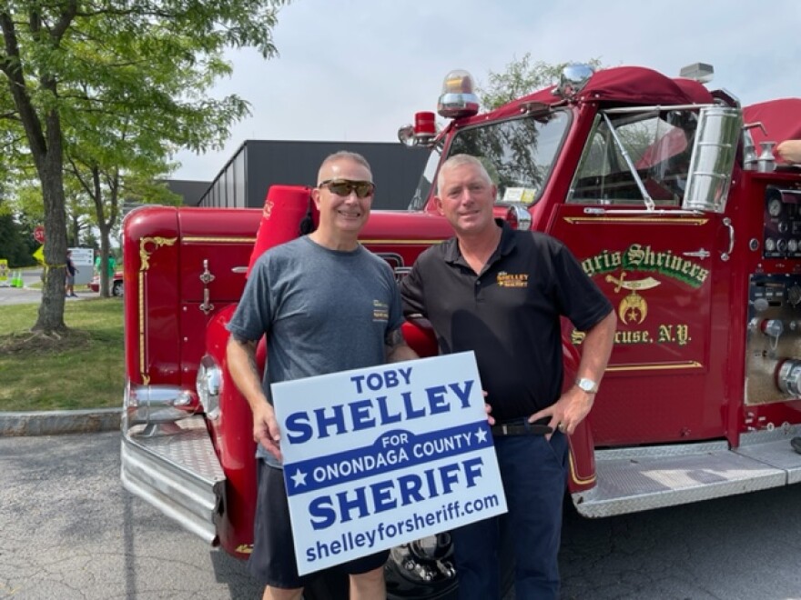 Onondaga County Sheriff - elect Toby Shelley, Right , stands with his supporters