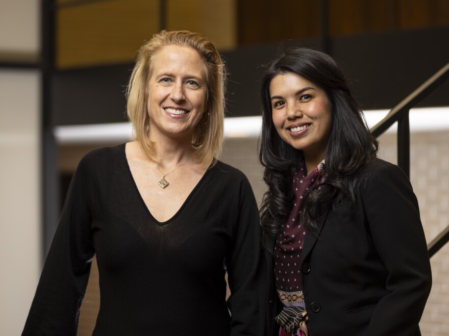 Rebecca Ford-Paz (left), a child psychologist at Lurie Children's Hospital, and Aimee Hilado, an social work professor at the University of Chicago, are leading a program that trains front-line workers in city-run shelters to form informal support groups for migrants, called <em>Café y Comunidad charlas — </em>coffee and community talks.