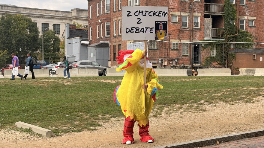 A man in a deflated chicken costume stands outside a campaign rally for Democratic candidate for Ohio governor Dr. Amy Acton at WOSU Public Media on October 14, 2026.