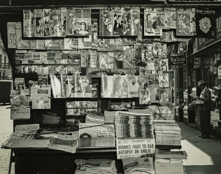 FILE: A stock image of an old sidewalk newspaper and magazine stand.