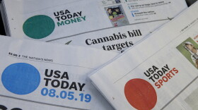 Sections of a USA Today newspapers rest together, Monday, Aug. 5, 2019, in Norwood, Mass. On Monday, Aug. 5, GateHouse Media, a chain backed by an investment firm, announced that it is buying USA Today owner Gannett Co.