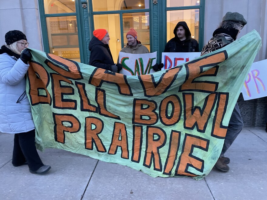 Environmentalists gather outside of the Rockford City Hall and host rally for the Bell Bowl Prairie