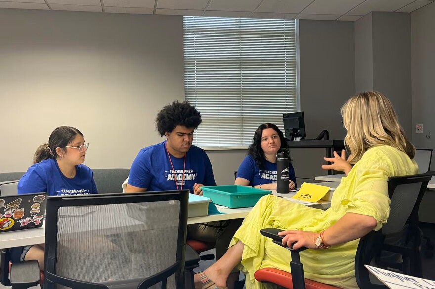 Brooke Hamlett works with students at the Teacher Prep Academy on Thursday, June 5, 2025 in Indianapolis. The program aims to help high schoolers explore possible careers in teaching through dual-credit courses, and by living on the University of Indianapolis campus for a week.