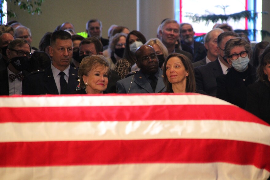 Dole's widow, Elizabeth, and daughter, Robin, watch the memorial service in Russell. 
