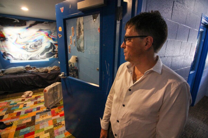 Simon Fulford, executive director of Parrott Creek Child and Family Services in Oregon City, looks into a resident's room. For months, his organization has tried to seek state funding for youth residential addiction services.