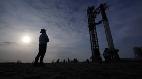 Visitors look on as SpaceX's Starship, the world's biggest and most powerful rocket, stands ready for a scheduled launch. (Eric Gay/AP)