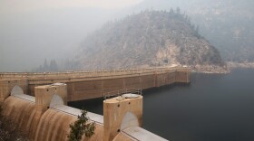Smoke from a wildfire lingers over the O'Shaughnessy Dam at Hetch Hetchy Reservoir in Yosemite National Park, Calif. (Justin Sullivan/Getty Images)