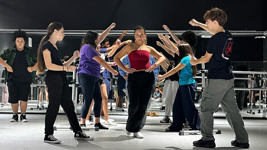 Teens practice choreography in a dance studio