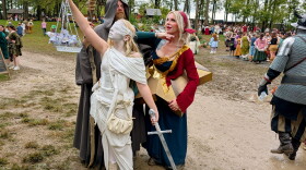 The Patton family from Cleveland dressed as album artwork. Shawn Patton (left) is the Hermit from "Led Zepplin IV", Amanda Patton (right) is dressed as the cover of Smashing Pumpkins' "Mellon Collie and the Infinite Sadness" and their 13-year-old daughter (center) is dressed as Lady Justice from Metallica's "...And Justice for All."