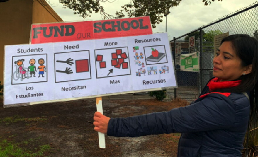 Speech pathologist Larisa Robedillo strikes outside Shenandoah Street Elementary School in Los Angeles.