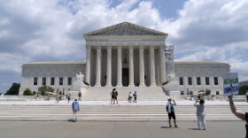 Visitors pose for photographs outside the U.S. Supreme Court Tuesday, June 18, 2024, in Washington. ( AP Photo/Jose Luis Magana)