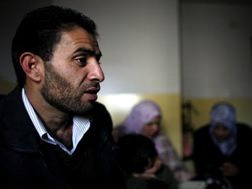 Bassam Aramin sits in the bedroom of his 10-year-old daughter, Abir, on the day of her wake in 2007.