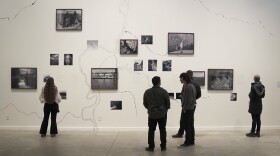 Group of people standing in an art gallery