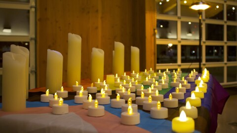 Candle display on table for Transgender Day of Remembrance