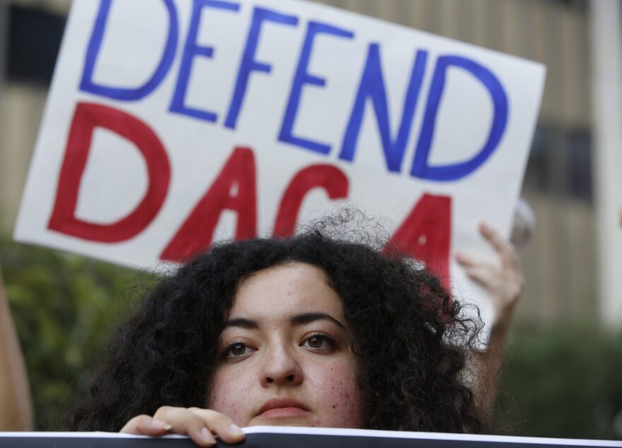 Loyola Marymount University student and DACA recipient Maria Carolina Gomez joins a rally in support of the Deferred Action for Childhood Arrivals, or DACA program outside the Edward Roybal Federal Building in Los Angeles Friday, Sept. 1, 2017. President Donald Trump says he'll be announcing a decision on the fate of hundreds of thousands of young immigrants who were brought into the country illegally as children in the coming days, immigrants he's calling "terrific" and says he loves. (Damian Dovarganes/AP)
