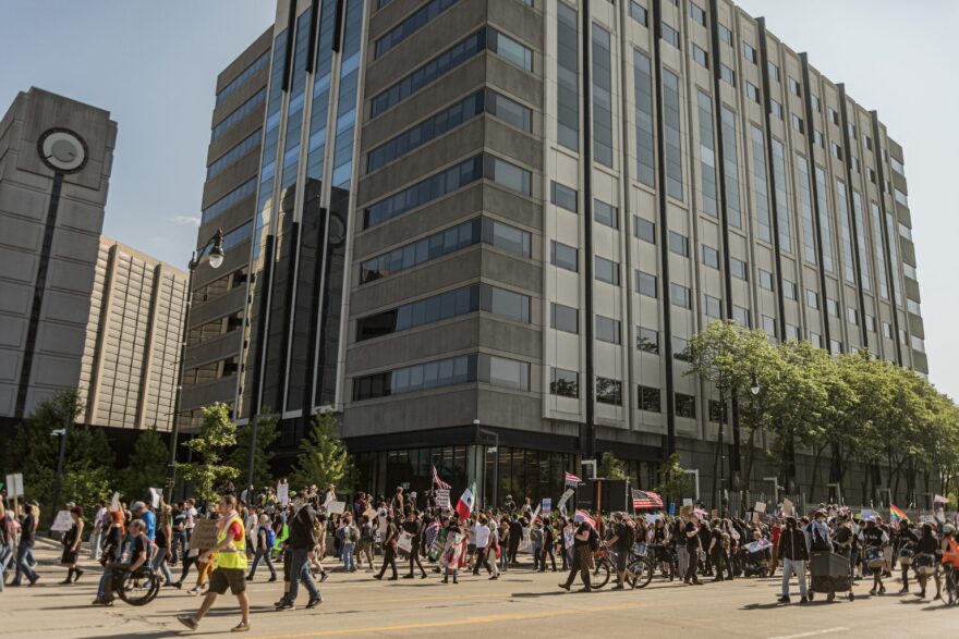 Protestors approached the outside of the Rosa Parks Federal Building in Detroit where they held a rally as part of the No Kings Day demonstration, June 14, 2025.