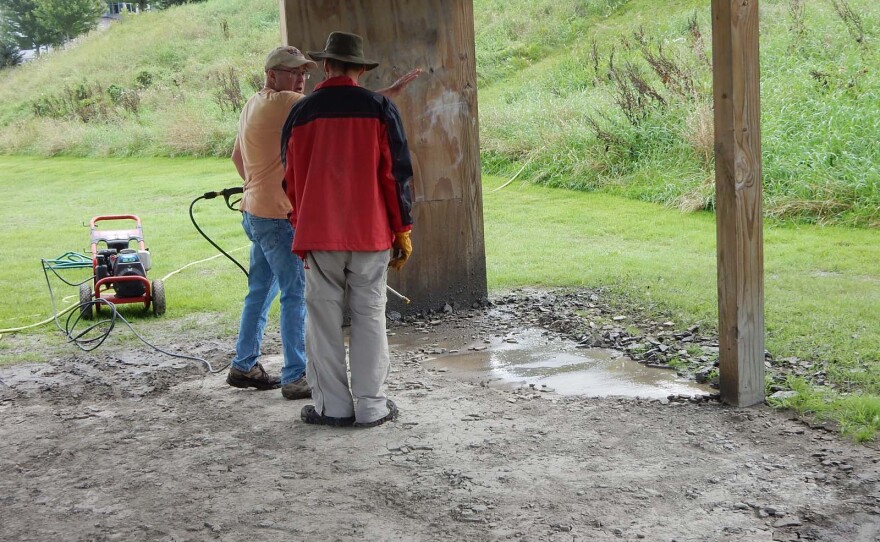 An initial try to power wash the mud from the pavilion floor