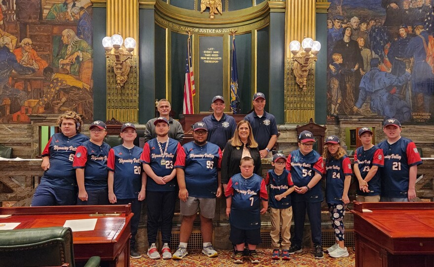 The Wyoming Valley Challenger team poses for a photo with Sen. Lisa Baker.