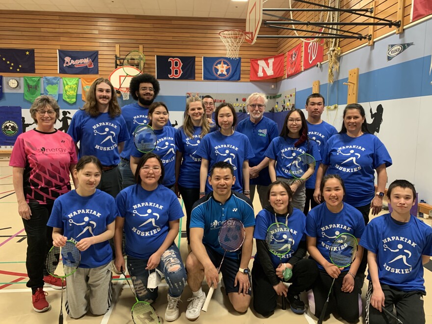 Napakiak players pause for a photo-op with U.S. Olympian Howard Bach at the Alaska State Badminton School Team Championship.