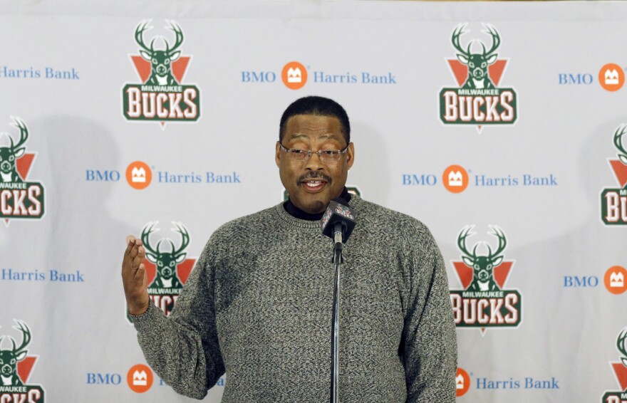 FILE - Former Milwaukee Bucks player Junior Bridgeman talks to the media before an NBA basketball game between the Bucks and Brooklyn Nets, March 1, 2014, in Milwaukee.