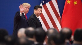 President Donald Trump (L) and China's President Xi Jinping leave a business leaders event at the Great Hall of the People in Beijing on November 9, 2017.
(NICOLAS ASFOURI/AFP via Getty Images)