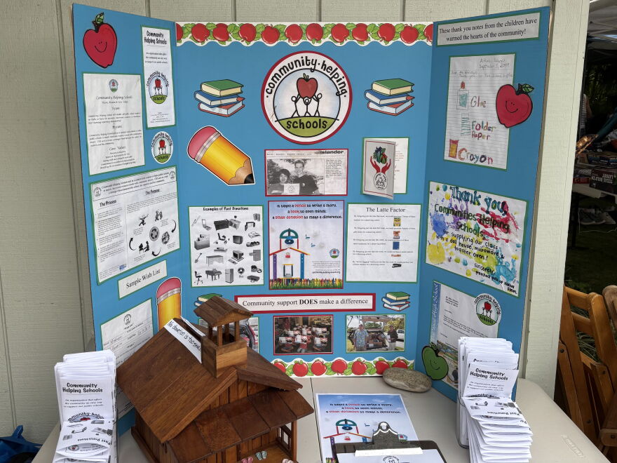 A posterboard illustrating the history, goals and mission statement behind the Community Helping Schools nonprofit, started by Kathie Wells in 2000. This was displayed at the organization's annual garage sale in Kailua on Aug. 15.
