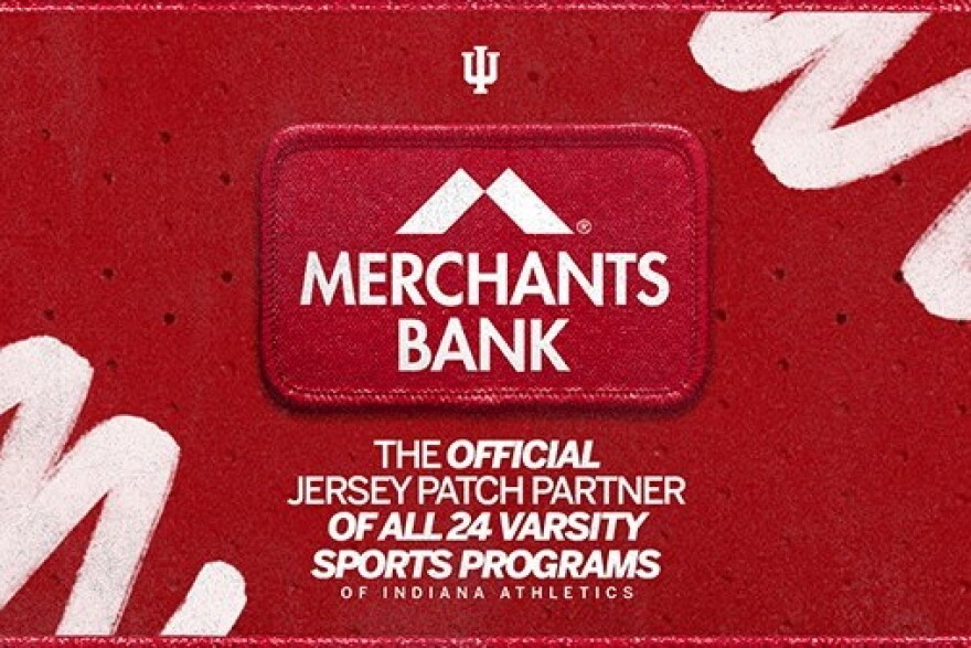 A red patch that says 'Merchants Bank'