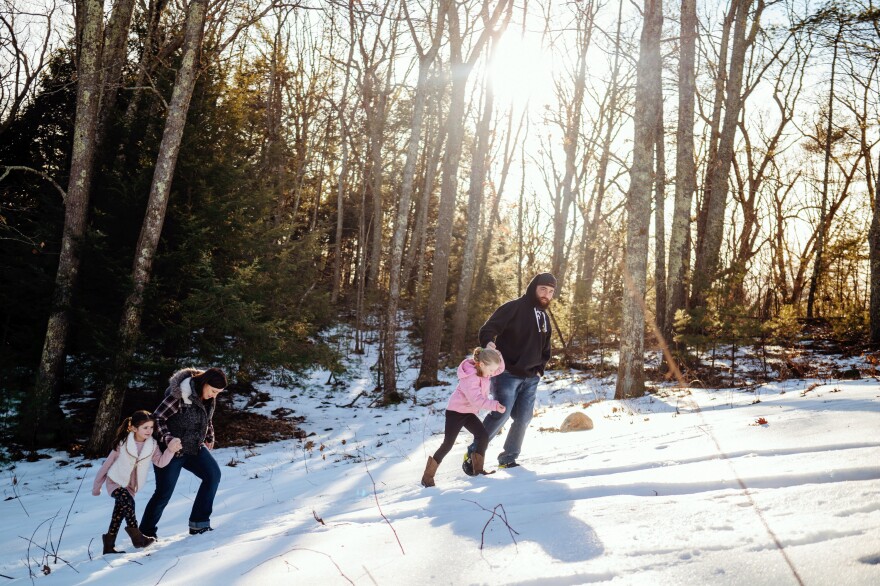 The Fords go for a walk down to the river on their 10-acre property, where they see everything from deer to moose to bald eagles. From left to right, Mckinley, 5; Jennifer; Addison, 7; and Andrew Ford.