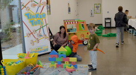 Erica Segal, director of the Central Oregon Children’s Museum, watches as her son Lincoln Segal, 6, tries to knock down a foam tower at the museum’s pop-up event on Oct. 11, 2026 in Bend.