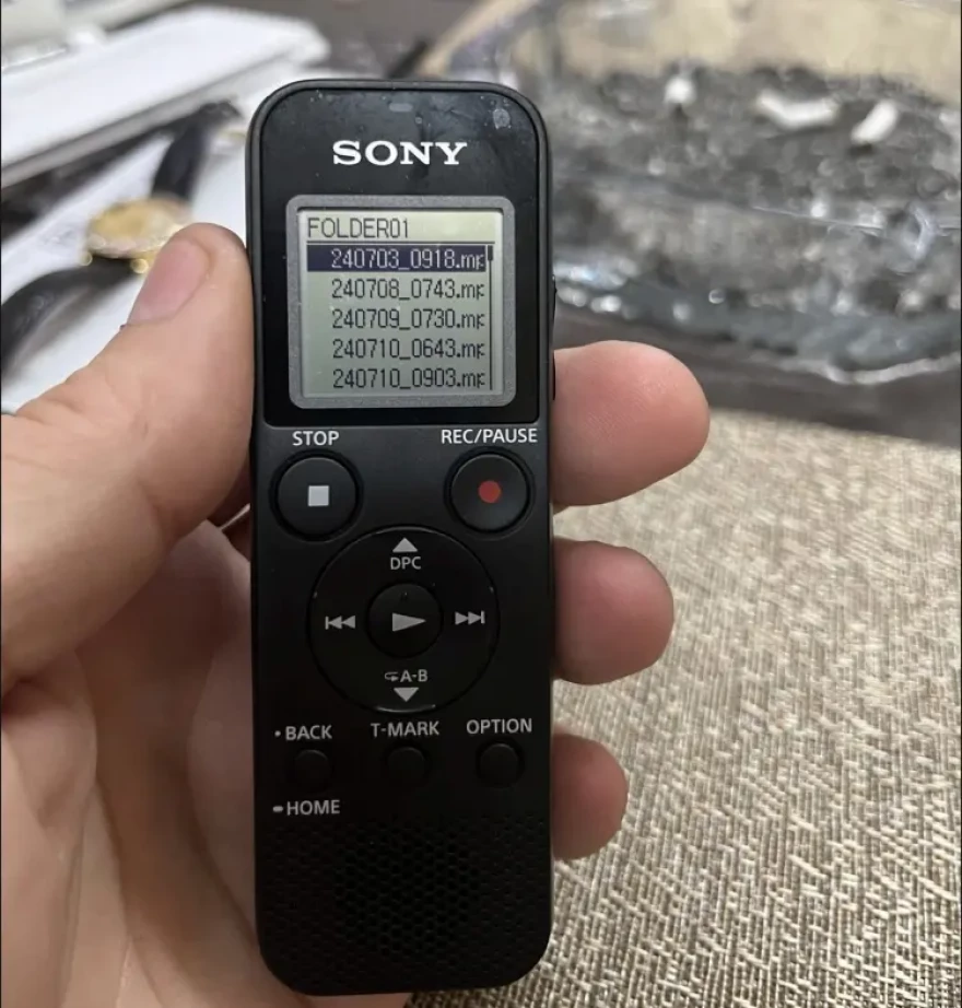 A photo of the recording device Romano received from investigators was included in the complaint.