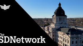 A hero image, diagonally split in two - one side has the SDPB logo and says "The SDNework," the other side shows an oblique view of the South Dakota State Capitol