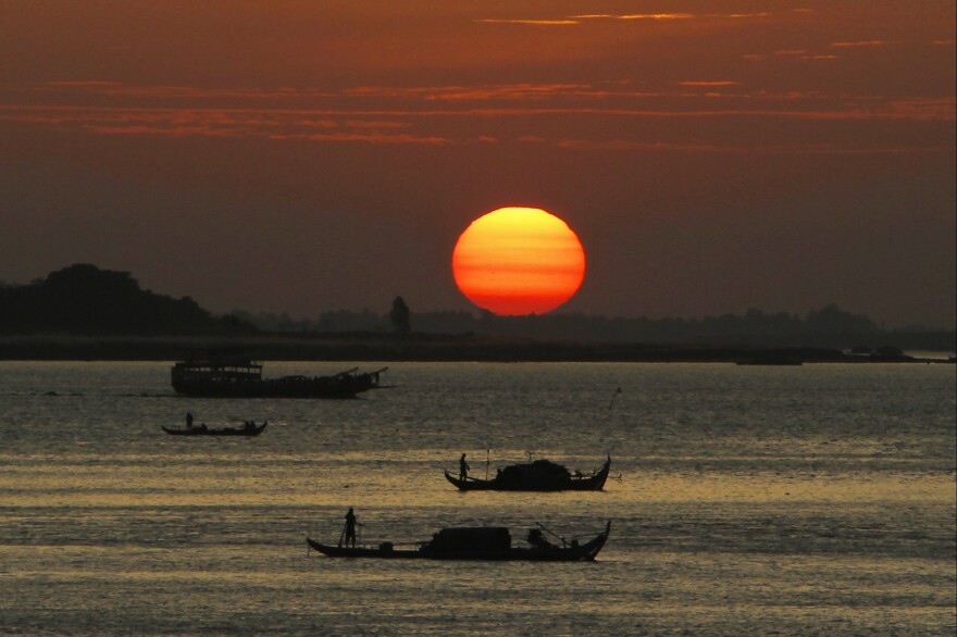 Cambodian fishermen take their motorized boats for fishing during fish harvesting season in the middle of Mekong river near Phnom Penh, Cambodia, Monday, Jan. 23, 2017.