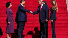 President Donald Trump, center right, shakes the hand of China's President Xi Jinping as first lady Melania Trump, right, and China's first lady Peng Liyuan, left, watch as they arrive at the National Archives Museum, Friday, Sept. 25, 2026, in Washington.