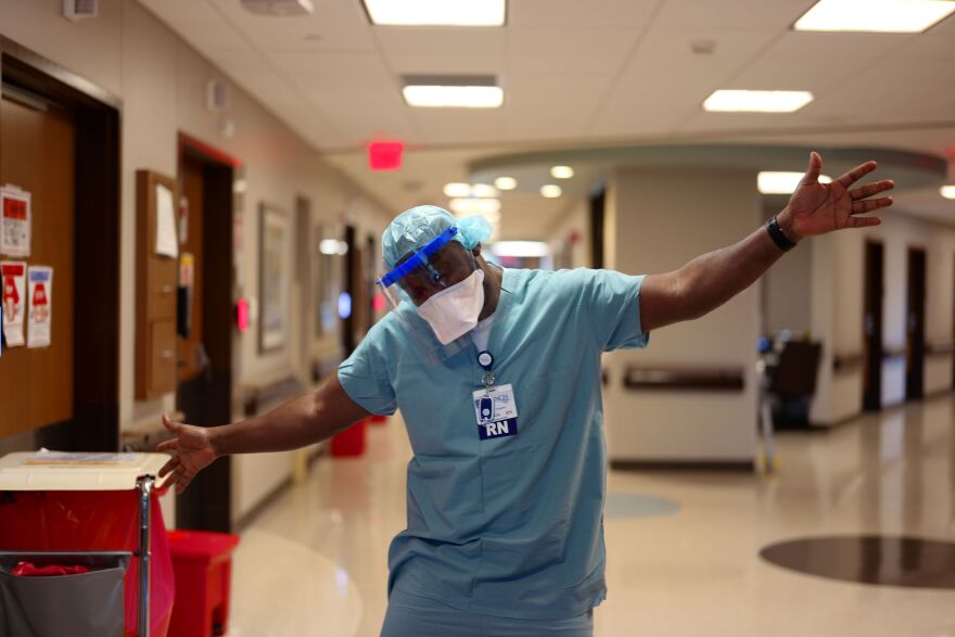 Registered Nurse Watson Camilus shows off his joyful jazz hands during one of his long shifts at NCH North Hospital Campus