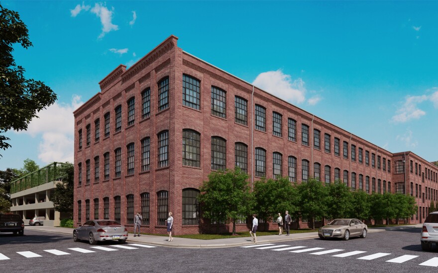  Ozanne Construction is renovating the former Blanket Mills building into a mixed-use development of apartments and commercial space.