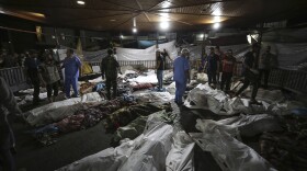 Bodies of Palestinians killed by an Israeli airstrike that hit the Ahli Arab hospital are seen gathered at the front yard of the al-Shifa hospital, in Gaza City, central Gaza Strip, Tuesday, Oct. 17, 2023.