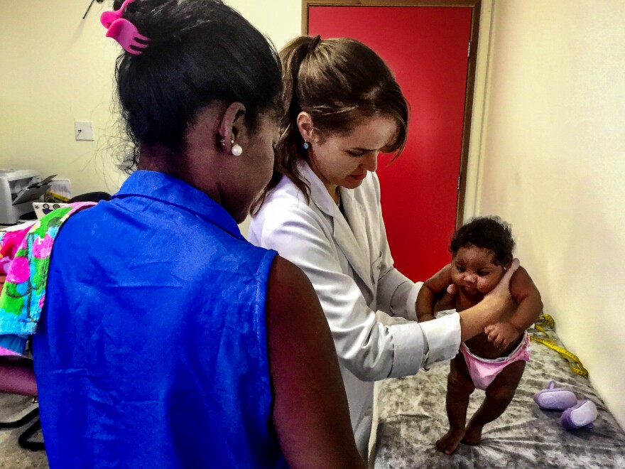 Dr. Adriana Mattos examines three-month-old Barbara Antonia, who has microcephaly. Her mother, Ana Claudia Teixera, caught the Zika virus when she was four months pregnant.