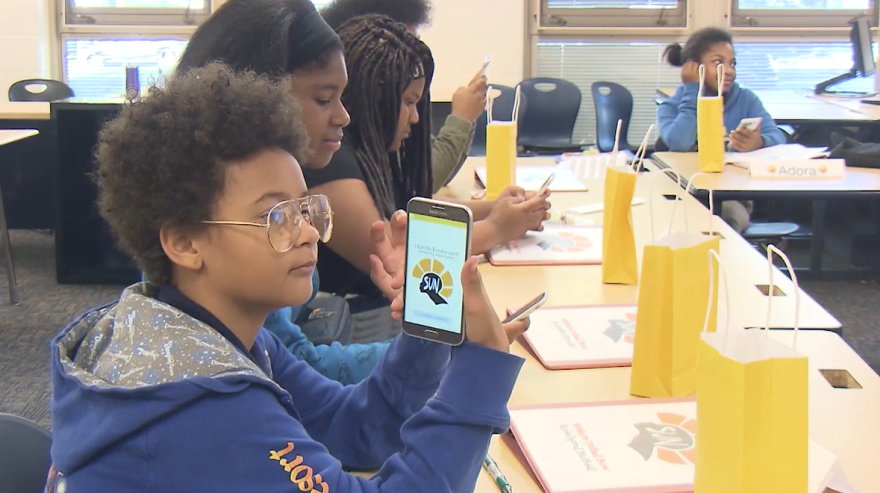 Roselynnd McNeal, a 7th grader at Buchtel Middle School, tries out the app. (Photo: ideastream)